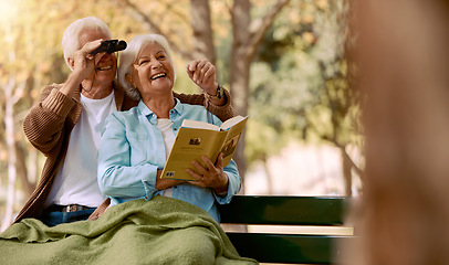 Image showing Love, senior couple and watching birds with book, binocular and romantic together. Romance, mature man and elderly woman in nature, happy and talking about animals, notebook and park bench for hobby.