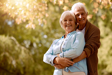 Image showing Nature, hug portrait and senior couple with mockup embracing outdoor in a park together during retirement. Happy, romance and love with a mature man and woman hugging in a garden with plants or trees