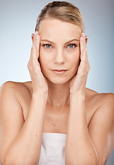 Image showing Portrait, woman and skincare in studio for beauty, wellness and eye lift with blepharoplasty on grey background. Face, model and facial for wrinkles prevention with girl hands on skin with mockup