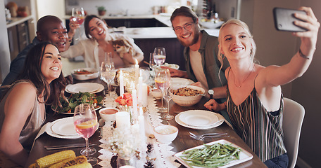 Image showing Selfie, dinner and party with friends eating food together for a new year celebration or event. Home, feast and meal with a man and woman friend group sitting at a table for a social gathering