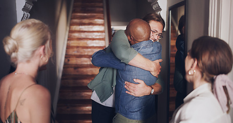 Image showing Hug, love and friends meeting at a reunion, home support and social celebration at a housewarming. Diversity welcome, affection greeting and men and women hosting a party to celebrate friendship