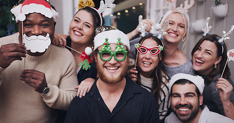 Image showing Portrait, Christmas and friends with a man and woman group in a home for a party or celebration together. Diversity, happy and mask with a male and woman friend crown in house for the festive season