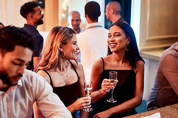 Image showing Friends, party and alcohol drink, champagne and event at restaurant, happy smile and crowd conversation at night. People talking, drinking and happiness at club together talking, fun and social