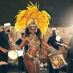 Image showing Samba, dance and black woman at Carnival to celebrate, night energy and holiday party in Rio de Janeiro, Brazil. Street band, music smile and portrait of a dancer at an outdoor festival dancing