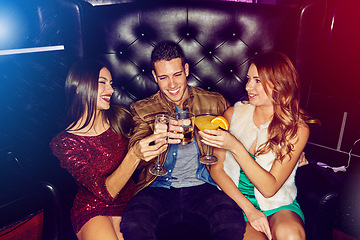 Image showing Party, toast and people celebrating at a nightclub being cheerful and having fun while enjoying nightlife. Clubbing, alcohol drinks and friends partying with cocktails at disco event to celebrate