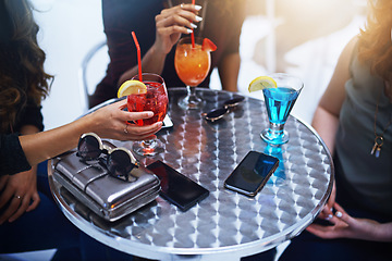 Image showing Hands of women, drinks and friends at club table, having fun and bonding. Party, celebration and group of girls with alcohol, cocktails or beverages drinking, having fun and enjoying time together.