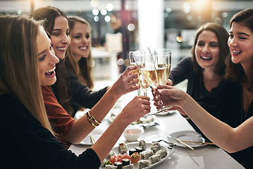 Image showing Restaurant, happy and friends toast celebration at gathering for bonding, wellness and care. Cheers, reunion and happiness of women friendship group together with sushi, champagne and smile.