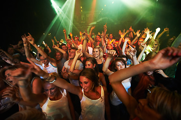 Image showing Party, music and dance with crowd at concert for rock, festival and live band performance. Light, laser and energy with audience listening to dj at club for disco, celebration and rave night event