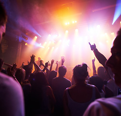 Image showing Crowd, stage lights and live band music in party event, nightclub festival or dance floor concert. People, musicians and audience dancing in spotlight social disco, techno rave or rock entertainment