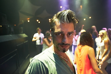 Image showing Concert, punk rock man and live band performance at an music festival, event or social party with crowd, fans or people at stage performance. Portrait of a male at club, nightclub or celebration show