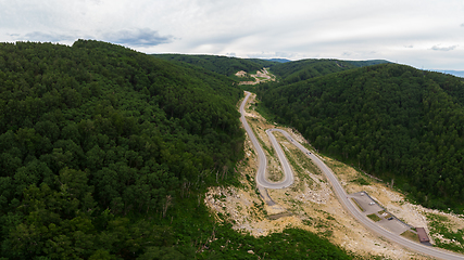 Image showing Aerial top vew of winding road in the mountains