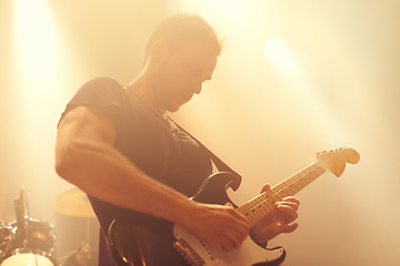 Image showing Music, concert and man with a guitar for performance, music festival or night club. Sound rehearsal, live stage and musician with an instrument at a live festival or show with a band playing audio