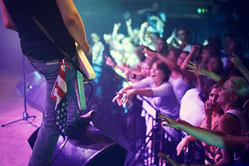 Image showing Guitar, concert and crowd at music festival, stage performance party, dance or celebration youth lifestyle. Audience, group of people or fans celebrate and star, musician or artist in disco nightclub