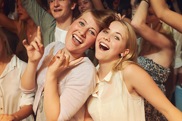 Image showing Rock, dance night and friends at a concert, disco event or band performance in the crowd. Happy party, music smile and portrait of dancing women at a rave music festival, show energy and celebration