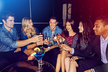 Image showing Toast, cocktail with friends in nightclub, party and celebrate new year with alcohol drinks and fun together in club. Cheers, celebration and holiday with friend group and drinking cocktails.