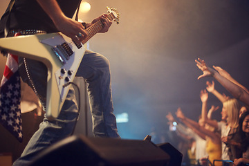 Image showing Concert musician, guitar and rock on stage for crowd, party or festival gig in night with american flag. Professional artist, band and music festival for event for talent, music solo and performance