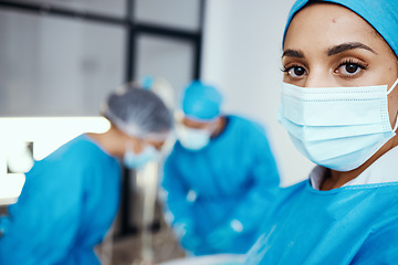 Image showing Portrait of woman, surgeon and operating room, hospital and healthcare emergency, surgery or medical clinic. Young female doctor, nurse or worker in face mask, scrubs and working in operation theatre