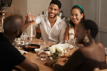 Image showing Wine, toast and party with friends at table of dining room for new year celebration, festive and social gathering. Drink, dinner and cheers with group of people at home for reunion, holiday and event