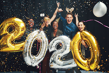 Image showing New years, balloons and friends with confetti in 2020 excited for party, festival celebration and future. Social event, glamour and portrait of group of men and women in studio for festive countdown