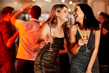 Image showing Women, laughing or bonding in champagne night party, clubbing event or birthday celebration in New York. Smile, happy people or friends with alcohol glasses on luxury restaurant or disco dance floor