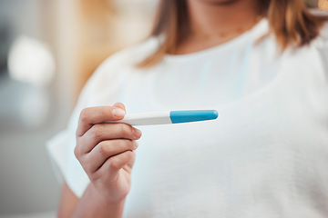Image showing Woman hands pregnancy test and reading for results, information or notification for baby in home. Girl, test and reading for pregnant, mother or family goal in house with blurred background in Dallas