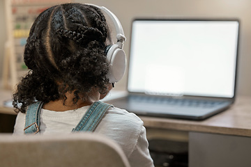 Image showing Girl learning, laptop and education in home with headphones, internet and blank screen for study. Young african student, female and computer for video call, internet or webinar at house in Toronto