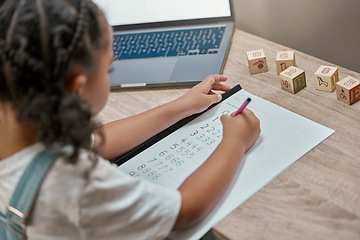 Image showing Girl learning, writing and paper for maths, study and cognitive development in home school with laptop. Young african student, female studying numbers and focus with pen, tech and thinking in house