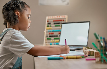 Image showing Girl writing, education toys and laptop in house with crayons, paper and mental development by desk. Young african child, female learner or pen for notes, drawing or learning in home school with pc