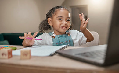 Image showing Girl, learning and elearning on laptop, math and education in homeschool, writing and online class at desk in home. Child, happy smile and count for development, education and learning for knowledge