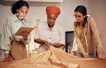 Image showing Creative woman, fashion design and tablet in teamwork for clothing, garment or material in startup at the office. Group of employee designers in fashion, collaboration and digital marketing stylist