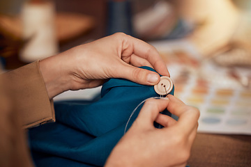 Image showing Womab, hands and sewing clothes button in studio for designer wear, fashion garment and creative fabric design. Tailor, boutique startup and fashion designer hand or seamstress working on clothing