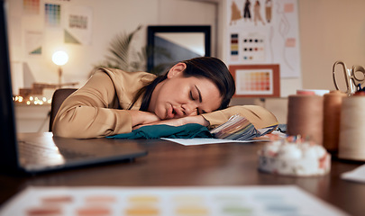 Image showing Tired, design and woman in fashion sleeping at a desk with burnout, stress and creative work in boutique at night. Fatigue, stressed and tailor or designer with clothes for fashion design in the dark