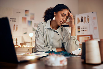 Image showing Stress, headache and fashion, woman designer in studio with laptop, burnout and financial anxiety. Finance, debt and overworked tired black woman working late on clothing design deadline in office.