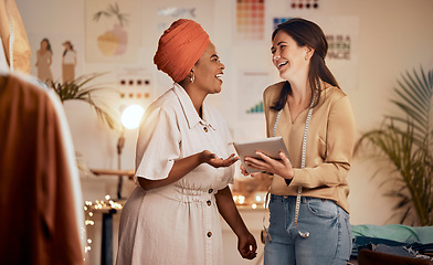 Image showing Designer woman, partner and fashion with tablet, laughing and joke while planning, clothes and web app. Teamwork, black woman and design team for comic, funny moment and social media in night at job