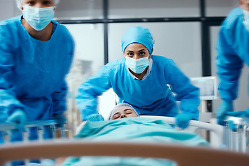 Image showing Surgeon, bed and rush in a hospital for emergency operation in the er with a sick patient. Surgery team, pushing sleeping woman and fast hospital bed in the theater for surgical medicine procedure