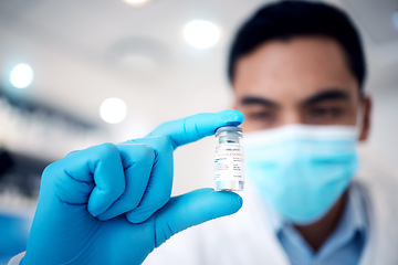 Image showing Covid, vaccine in hand and doctor, health and gloves for safety, face mask and medicine glass bottle zoom with corona virus immunization. Protection from disease, healthcare and medical innovation.