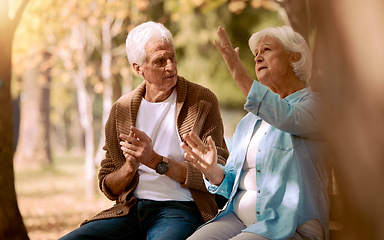 Image showing Senior couple, nature park and conversation for support, communication and relax in sunshine together. Elderly man, woman and sign language in garden, backyard and peace in retirement with disability