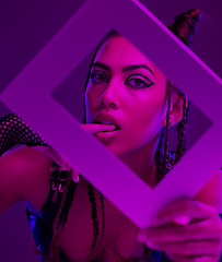 Image showing Woman punk, fashion frame and portrait in dark studio, edgy makeup and goth cosmetics with style. Model, black woman and beauty aesthetic with shadow, purple or lavender background with modern art