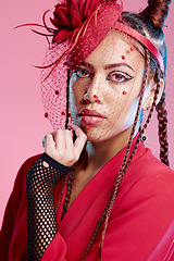 Image showing Portrait of edgy woman, creative fashion with vintage aesthetic or unique retro style in San Francisco studio. Young girl with designer clothing, unique funky accessories or model on pink background