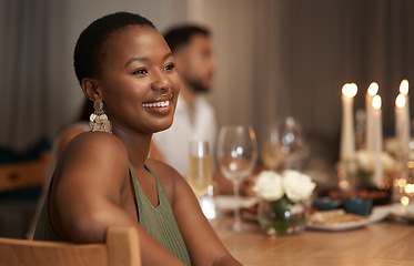 Image showing Dinner, party and thinking with a black woman at a table in celebration of the new year or a birthday. Event, idea and social with a young female sitting in a home or house for the festive season