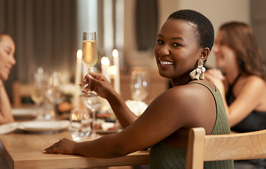 Image showing Friends, champagne and portrait girl at dinner celebration party to celebrate happy new year in house dining room. Candle, home fine dining and black woman at social holiday event with alcohol drinks