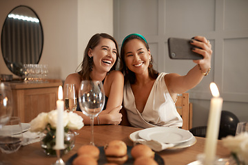 Image showing Woman, friends and smile for phone selfie, dinner or friendship together at home or fine dining. Happy women smiling for photo in celebration with mobile smartphone at the dinner table indoors