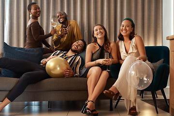 Image showing Party, new year and alcohol with friends on a sofa together in celebration of a milestone event. Birthday, happy and bonding with a man and woman friend group in a living room to relax or celebrate