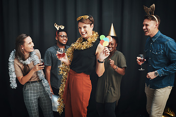 Image showing Party, friends and holiday photobooth portrait of office christmas party or new year. Diversity, happy and alcohol drinks to celebrate social event with wine and fashion props feeling fun and comic