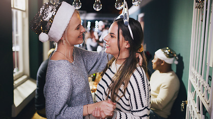 Image showing Lesbian couple, dance and Christmas party in home or festive celebration. Event, love and romance of women dancing face to face, holding hands and celebrating holiday together in house with friends.