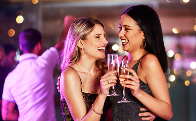 Image showing Party, champagne and lesbian couple toast at nightclub, having fun and bonding. Celebration, cheers and happy women with wine or alcohol at new year event, laughing or enjoying quality time together.