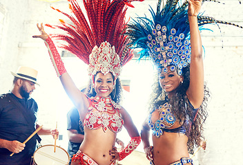 Image showing Carnival, dance celebration and women at a festival to party, salsa performance and culture event in Rio de Janeiro, Brazil. Music festival, dancing and portrait of dancer with a band at new year