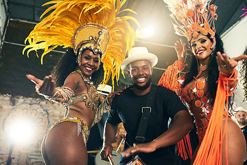 Image showing Carnival, brazil and band with woman dancers outdoor together for a new year celebration in rio de janeiro. Portrait, party and event with a man and female performance artists celebrating tradition