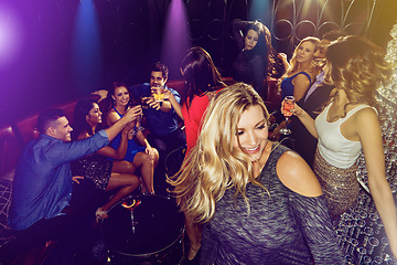 Image showing Party, dancing and drinks with people, crowd and women with alcohol for birthday, happy hour or new year celebration at nightclub, event or club. Friends celebrate with cocktails and fun energy