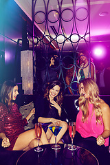 Image showing Party, new years eve and women drinking in a nightclub while having fun with comic communication. Talking, laughing and friendship with partying group of ladies enjoying nightlife and cocktail drinks